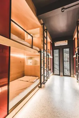 a room with bunk beds in a hostel at CLOUD on Saladaeng Silom Hostel Bangkok in Bangkok
