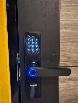 a close up of a blue button on a refrigerator at DDM House in Bangkok