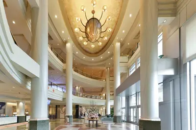 a large lobby with a chandelier on the ceiling at Miracle Grand Convention Hotel in Bangkok