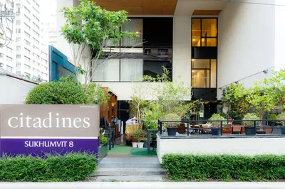 a building with a sign in front of it at Citadines Sukhumvit 8 Bangkok in Bangkok