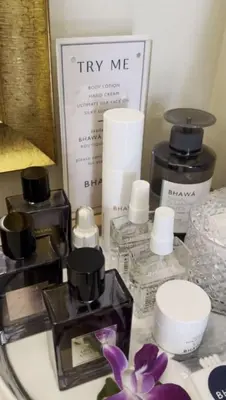 a group of perfumes and cosmetics sitting on a counter at Citadines Sukhumvit 8 Bangkok in Bangkok