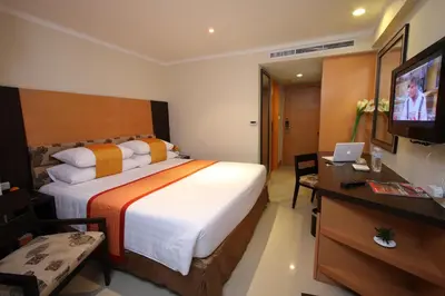a hotel room with a large bed and a television at Citin Pratunam Bangkok by Compass Hospitality in Bangkok