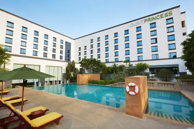 a hotel with a pool and a hotel at Dusit Princess Srinakarin Bangkok in Bangkok