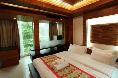 a bedroom with a large bed with towels on it at Baannueng at Aree 5 Hotel in Bangkok