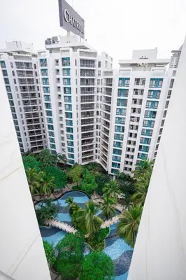 an aerial view of palm trees and buildings at Chatrium Sathon Bangkok in Bangkok