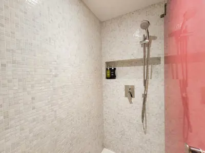 a bathroom with a shower with a shower head at Citrus Sukhumvit 13 Nana Bangkok by Compass Hospitality - Newly Renovated in Bangkok