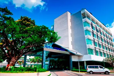 a white car parked in front of a building at Royal Princess Larn Luang - SHA Extra Plus in Bangkok