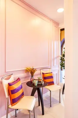 a dining room with a table and chairs at Studio Asoke in Bangkok