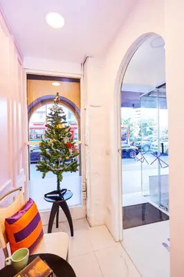 a christmas tree in the corner of a room at Studio Asoke in Bangkok