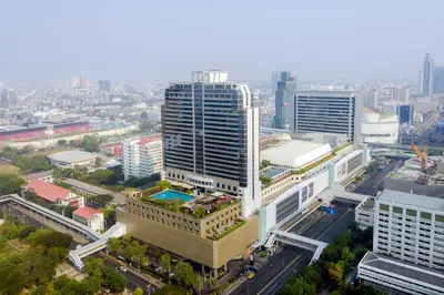 an aerial view of a city with tall buildings at Pathumwan Princess Hotel in Bangkok