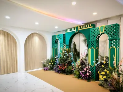a room with a display of flowers on the wall at Metro Point Bangkok in Bangkok