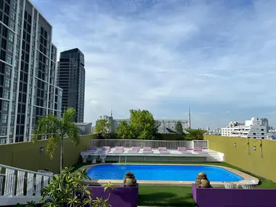 a swimming pool on the roof of a building at The Victory Residences Bangkok in Bangkok
