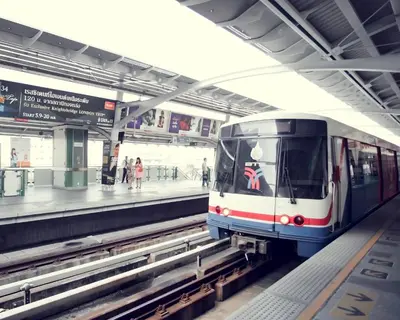 a subway train pulling into a subway station at Bangkok Loft at Nana Station in Bangkok