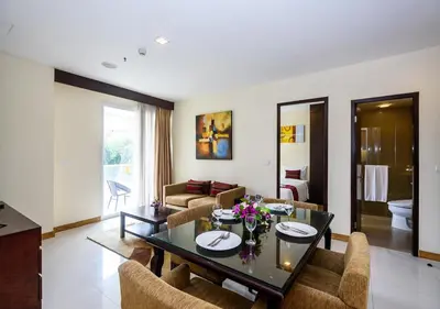 a living room with a table and chairs at Lohas Residences Sukhumvit 2 in Bangkok
