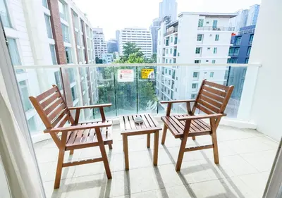 two chairs and a table on a balcony at Lohas Residences Sukhumvit 2 in Bangkok