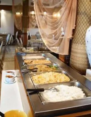 a buffet line with many trays of food at Collection O Howard Square Boutique Hotel in Bangkok