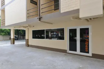 a building with a clock on the side of it at Studio Residence Sukhumvit 71 in Bangkok