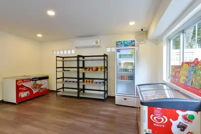 a room with a refrigerator and a soda at Studio Residence Sukhumvit 71 in Bangkok