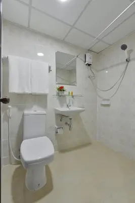a bathroom with a toilet and a sink at Studio Residence Sukhumvit 71 in Bangkok