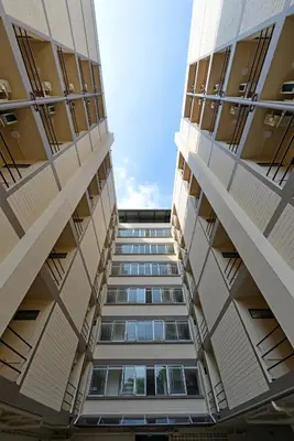 a view from the bottom of two tall buildings at Studio Residence Sukhumvit 71 in Bangkok