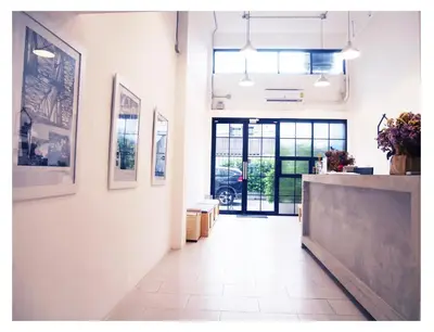 a hallway with a counter in a room at The Companion in Bangkok