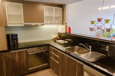 a kitchen with a sink and a counter top at Oakwood Residence Sukhumvit Thonglor Bangkok in Bangkok