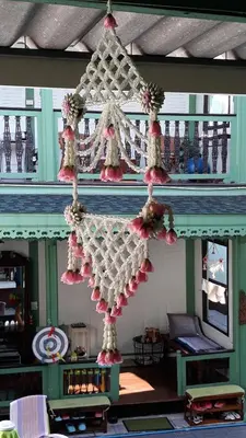a chandelier hanging from the ceiling of a room at Green Teak House in Bangkok