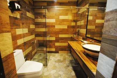 a bathroom with a toilet and a sink at Focal Local Bed & Breakfast in Bangkok