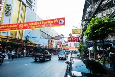 a busy city street filled with traffic and buildings at Arawana Express Chinatown in Bangkok