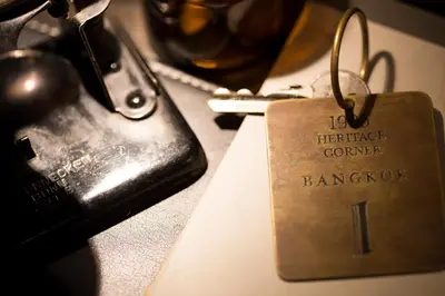 a tag that is sitting on top of a table at 1905 Heritage Corner in Bangkok