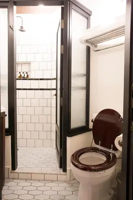 a bathroom with a toilet and a shower at 1905 Heritage Corner in Bangkok