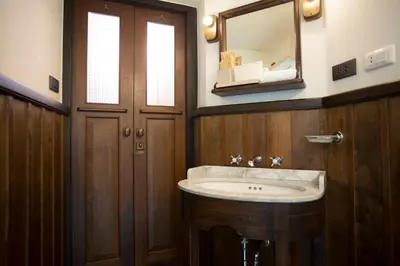 a bathroom with a sink and a mirror at 1905 Heritage Corner in Bangkok
