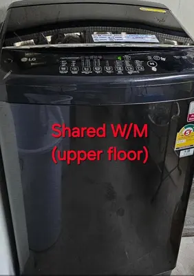 a hardened wimimp floor sign on the side of a computer monitor at Double D Rooms & Cafe in Bangkok