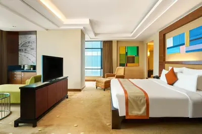 a hotel room with a bed and a flat screen tv at AETAS lumpini in Bangkok
