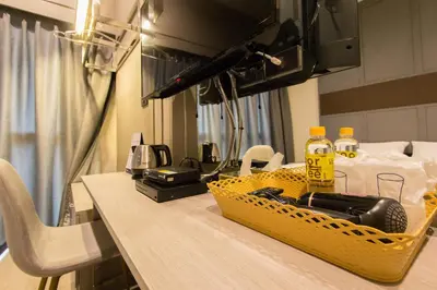 a table with a yellow basket on top of it at Lazy Sunday hostel in Bangkok