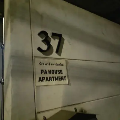 a sign on a building that says pa house apartment at PA House Apartment in Bangkok