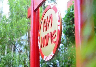 a sign that says no change on a red pole at Ayi Home in Bangkok