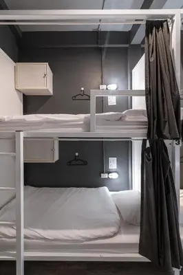 a room with two bunk beds in it at The Cocoon Hostel in Bangkok