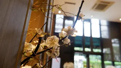 a bunch of white flowers in a vase at 18 Residence in Bangkok