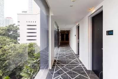 a hallway of a building with a large window at Best Western Sukhumvit 20 in Bangkok