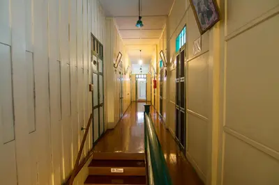 a long hallway with stairs in a building at Samsen Sam Place in Bangkok