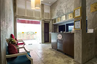 a restaurant lobby with a counter and a counter sidx sidx sidx at Buddy Boutique Inn in Bangkok