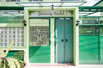 a front door of a greenway hospital with a blue door at Greenery Hostel in Bangkok