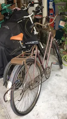 a bike is parked in a garage at Autta house in Ban Lat Tanot