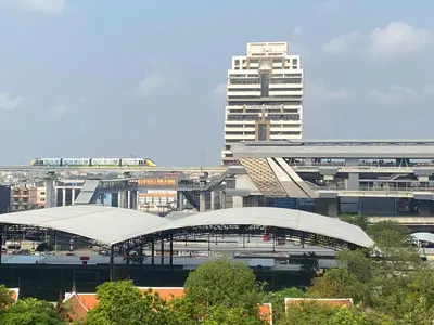 a city with a train station and a tall building at Penthouse by JJ in Bangkok
