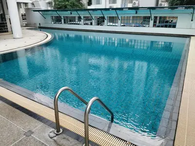 a swimming pool with a stairway leading into a building at Penthouse by JJ in Bangkok