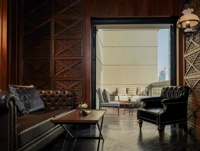 a living room with a couch and a table at Hotel Muse Bangkok, Autograph Collection by Marriott in Bangkok