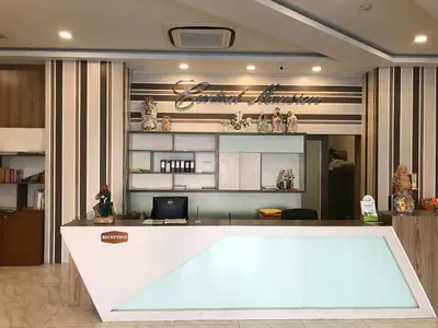 a kitchen with a white counter top in a room at Central Mansion in Bangkok