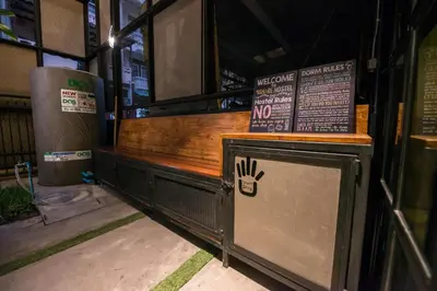 a fast food restaurant with a no smoking sign on it at 4SHARE Hostel in Bangkok
