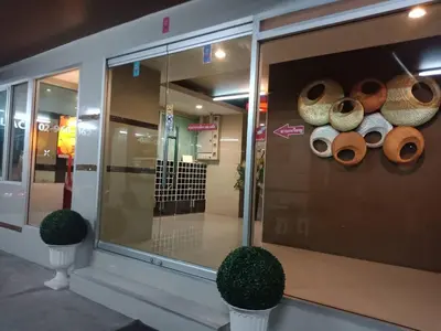 a store window with a bunch of donuts on display at Crystal Place Parkkred in Nonthaburi